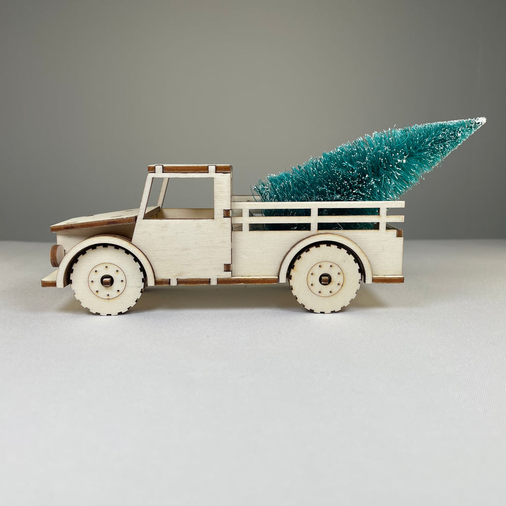 Curious Rabbit Christmas truck flatpack model kit with a Christmas tree, ready to assemble for holiday decoration.