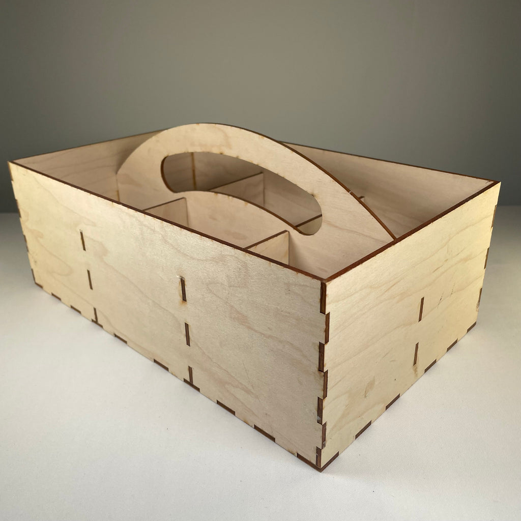 Curious Rabbit seedbox with handle, flatpack garden kit, showing assembled wooden seed storage container with handle in natural wood finish.