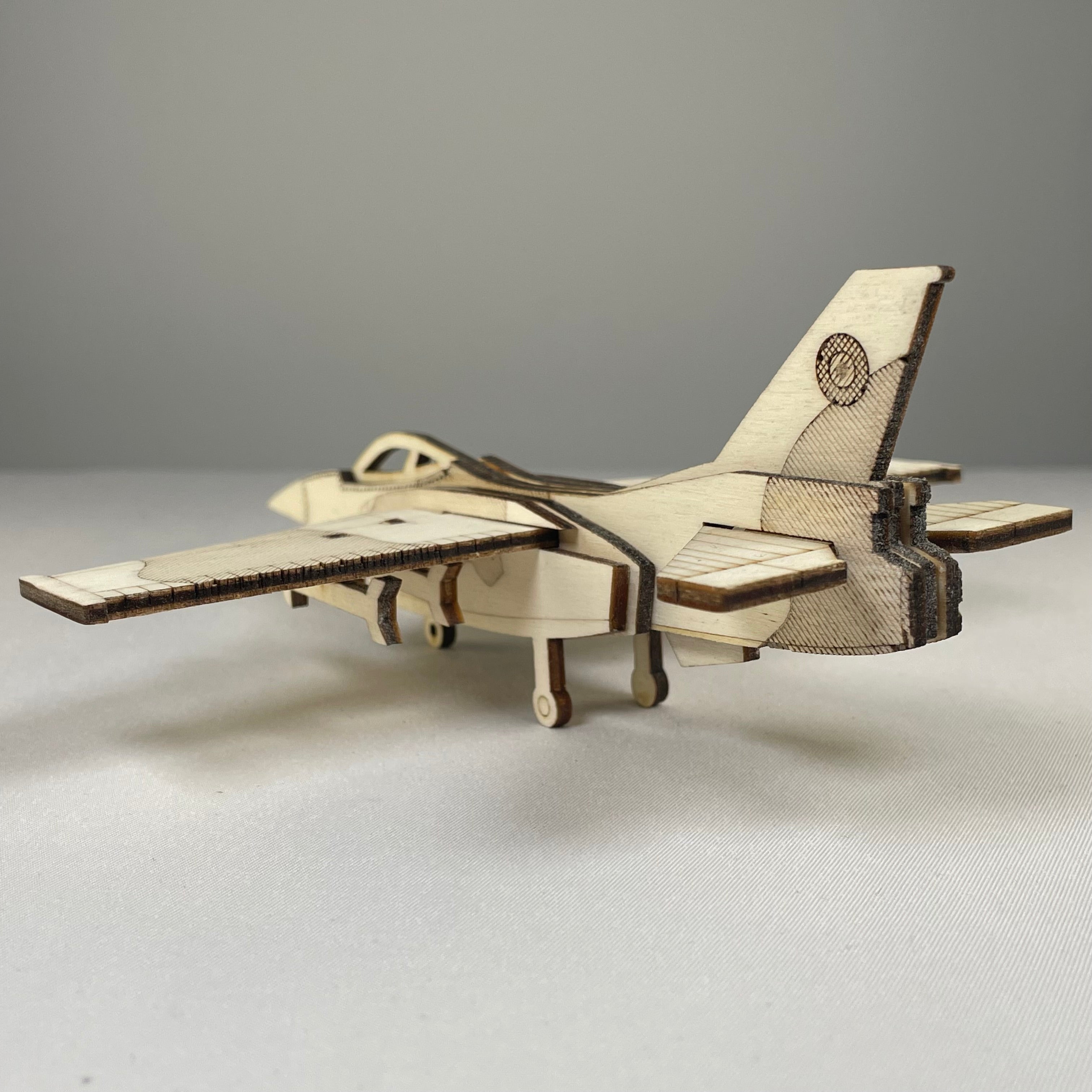 Curious Rabbit Jet Puzzle flatpack model kit featuring a detailed historical jet aircraft assembled from flatpack pieces.