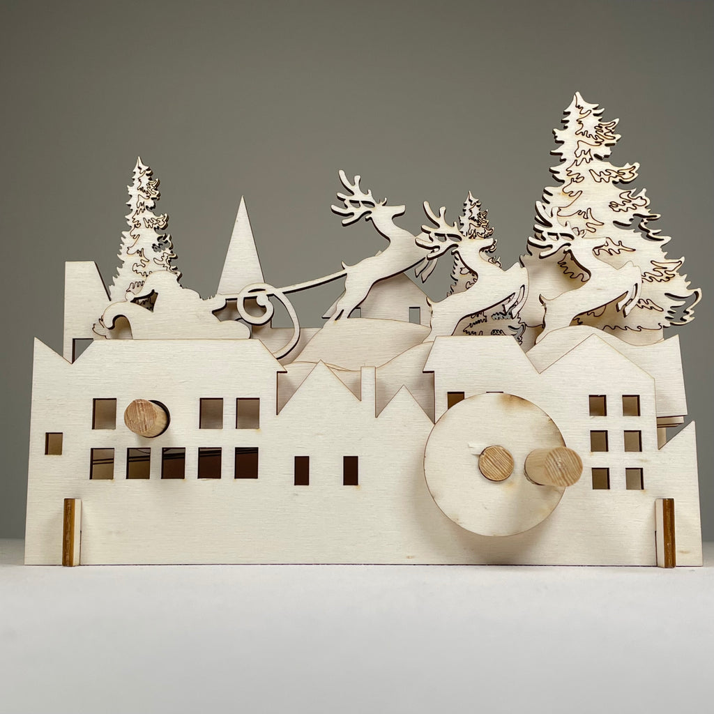 Curious Rabbit Mechanical Santa Sleigh flatpack model kit for Christmas, featuring detailed parts and festive holiday design.