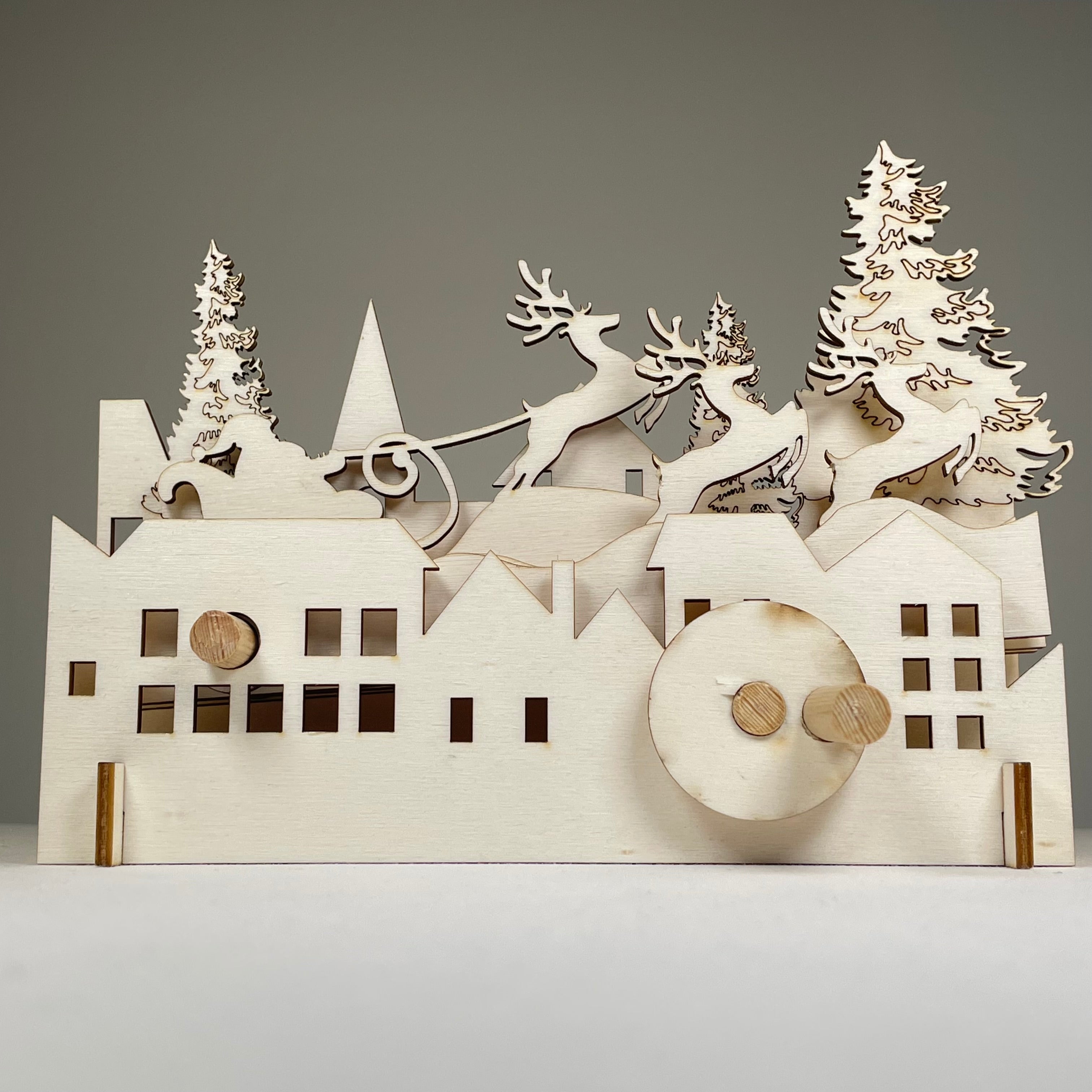 Curious Rabbit Mechanical Santa Sleigh flatpack model kit for Christmas, featuring detailed parts and festive holiday design.
