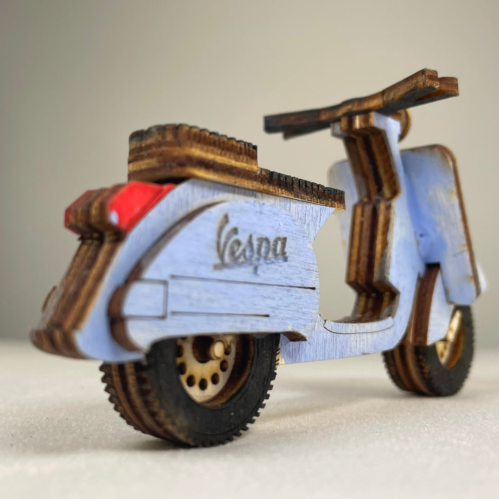 Vintage Curious Rabbit Retro Scooter flatpack model kit with assembled parts and colorful details.