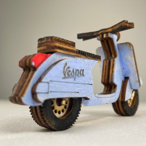 Vintage Curious Rabbit Retro Scooter flatpack model kit with assembled parts and colorful details.