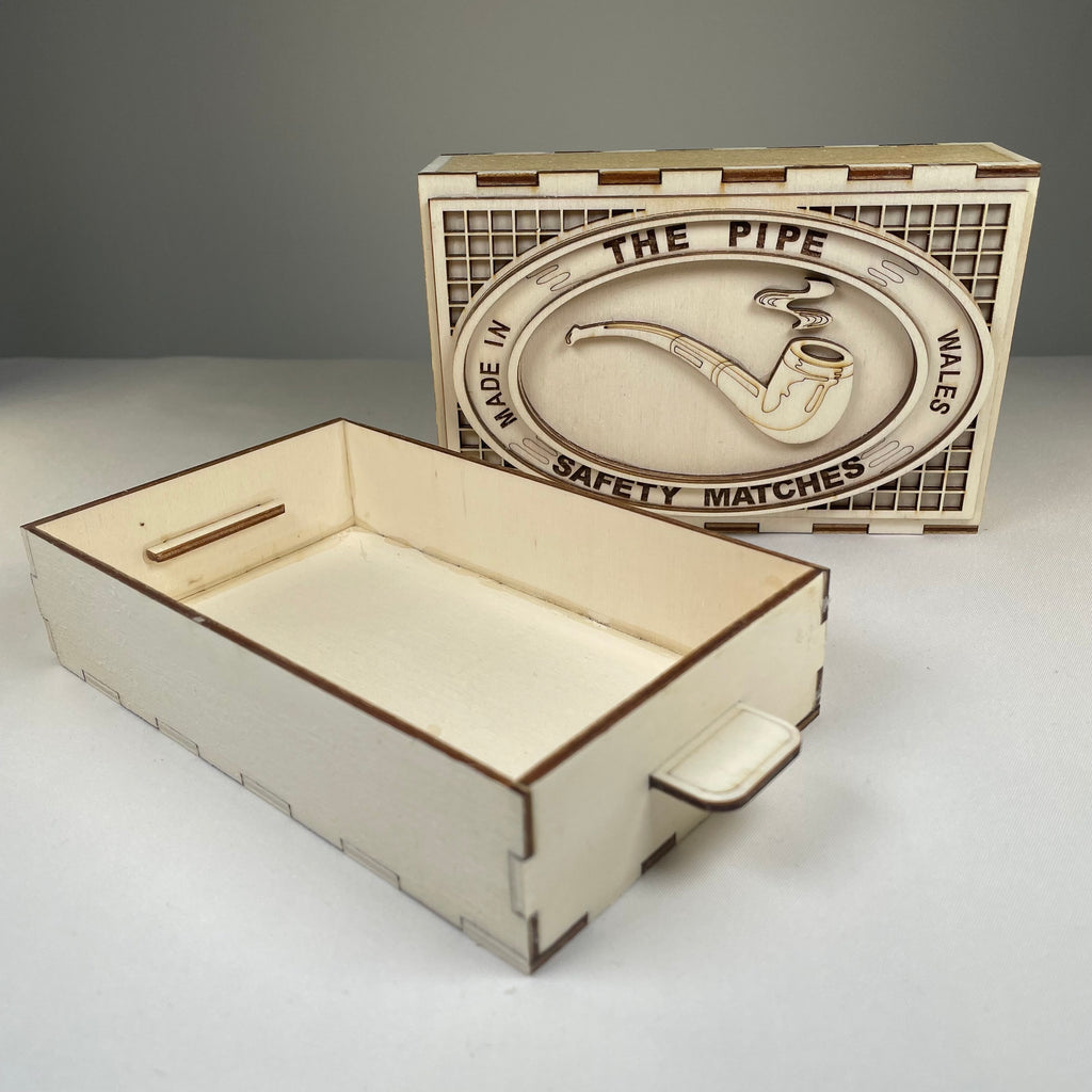 Vintage Curious Rabbit Matchbox pipe flatpack model kit with detailed paper parts and colorful packaging.