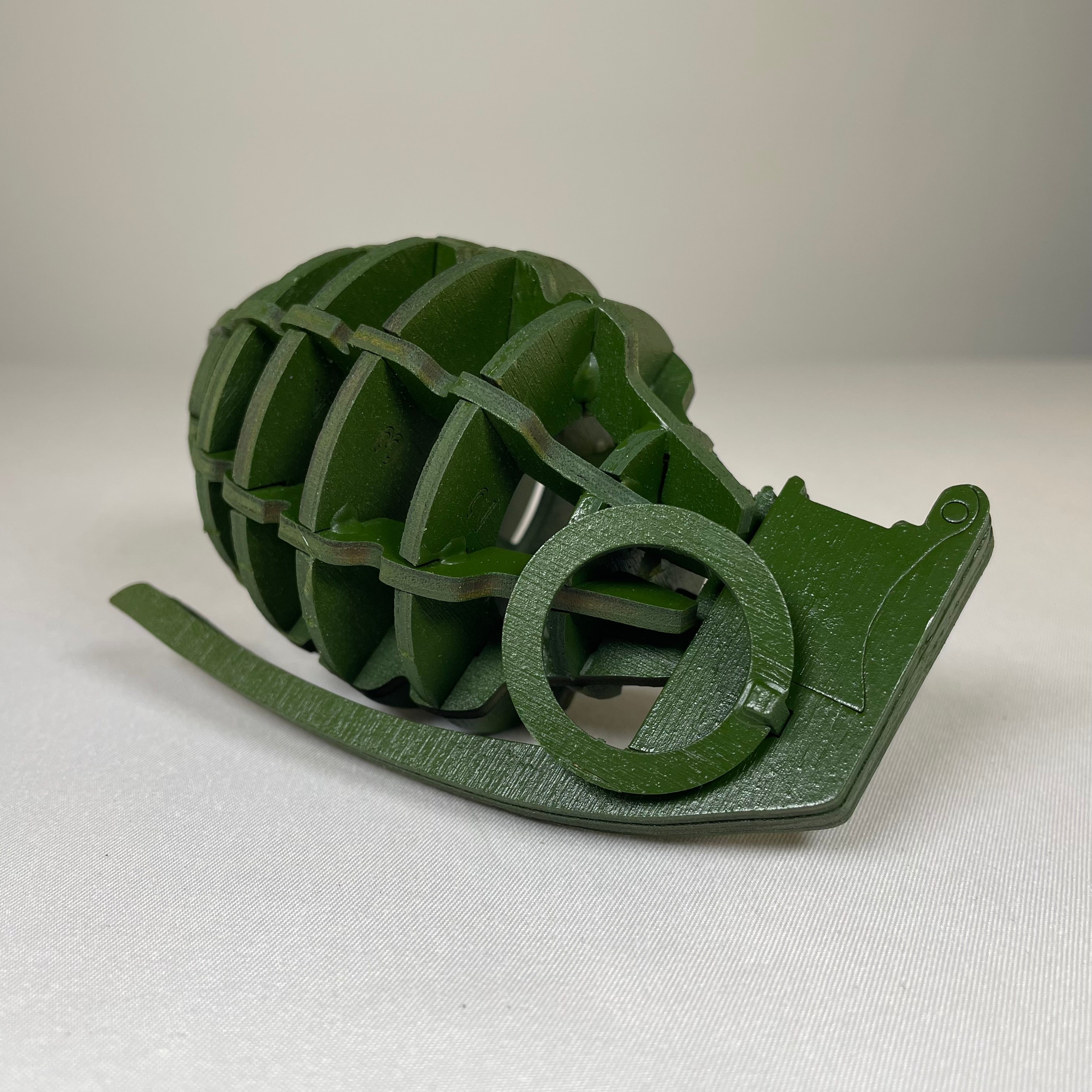 Curious Rabbit Prop Mk 2 Grenade flatpack model kit for historical display, with detailed plastic parts and assembly instructions.