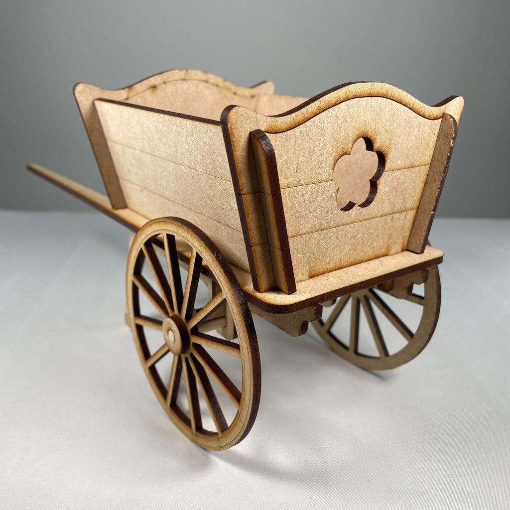 Curious Rabbit flatpack garden cart planter kit with assembled wooden components and planting space for indoor or outdoor use.