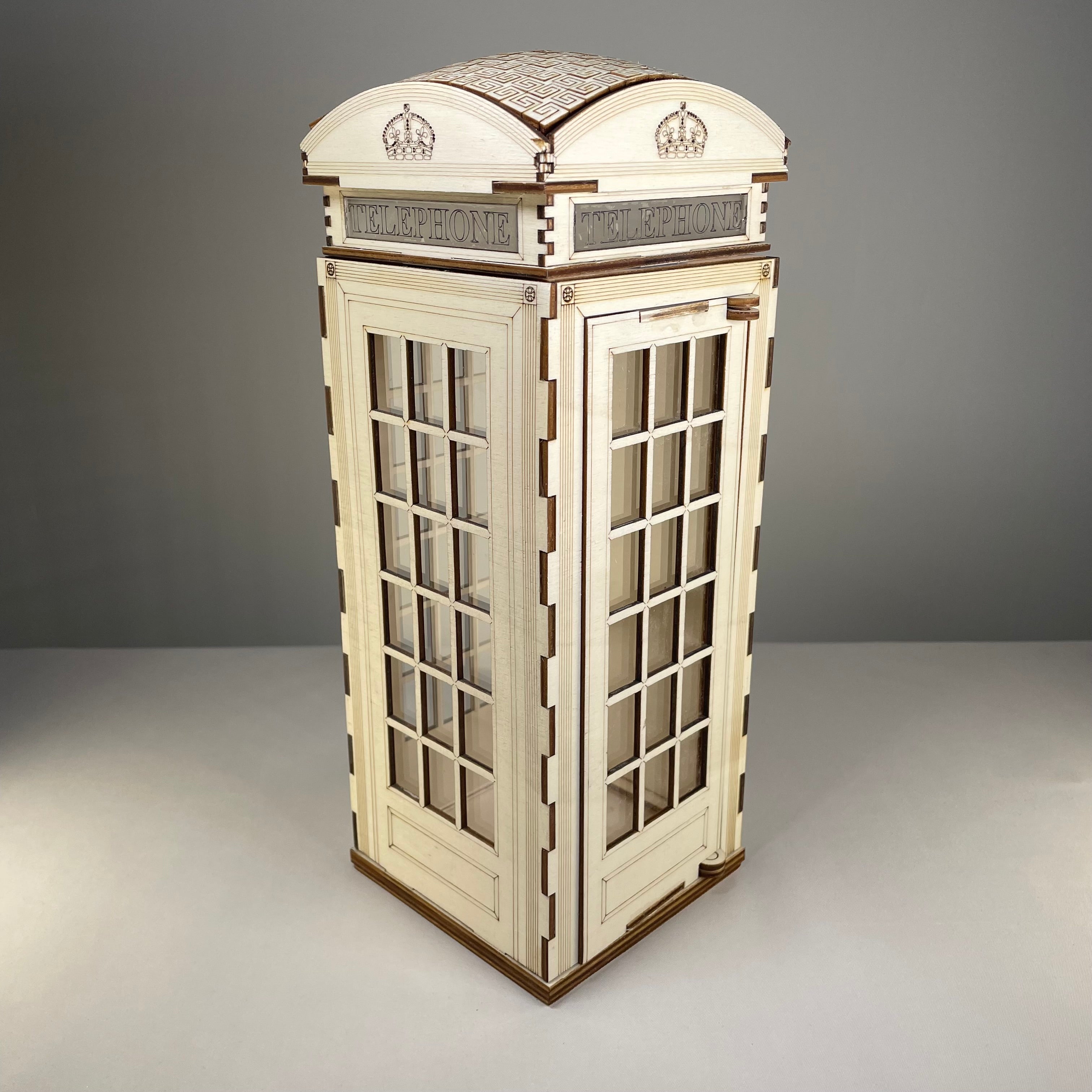 Curious Rabbit Telephone Box Lamp flatpack model kit with icon-style design, showing assembled lamp featuring a vintage telephone box shape.