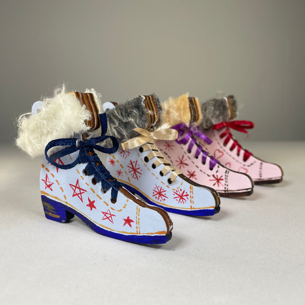 Handmade Christmas ice skate ornament by Curious Rabbit, featuring detailed craftsmanship and festive holiday design.