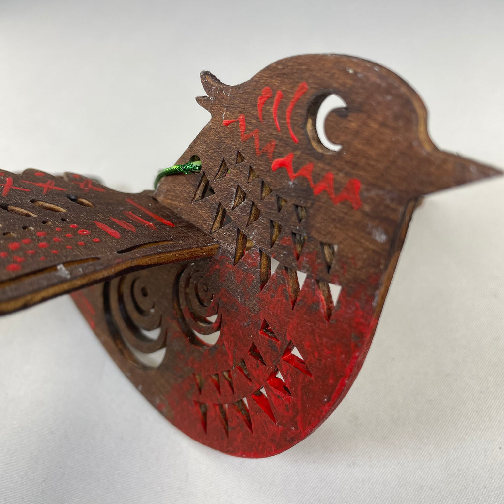 Handmade Christmas bird bauble ornament by Curious Rabbit, featuring festive holiday design with vibrant colors and detailed craftwork.