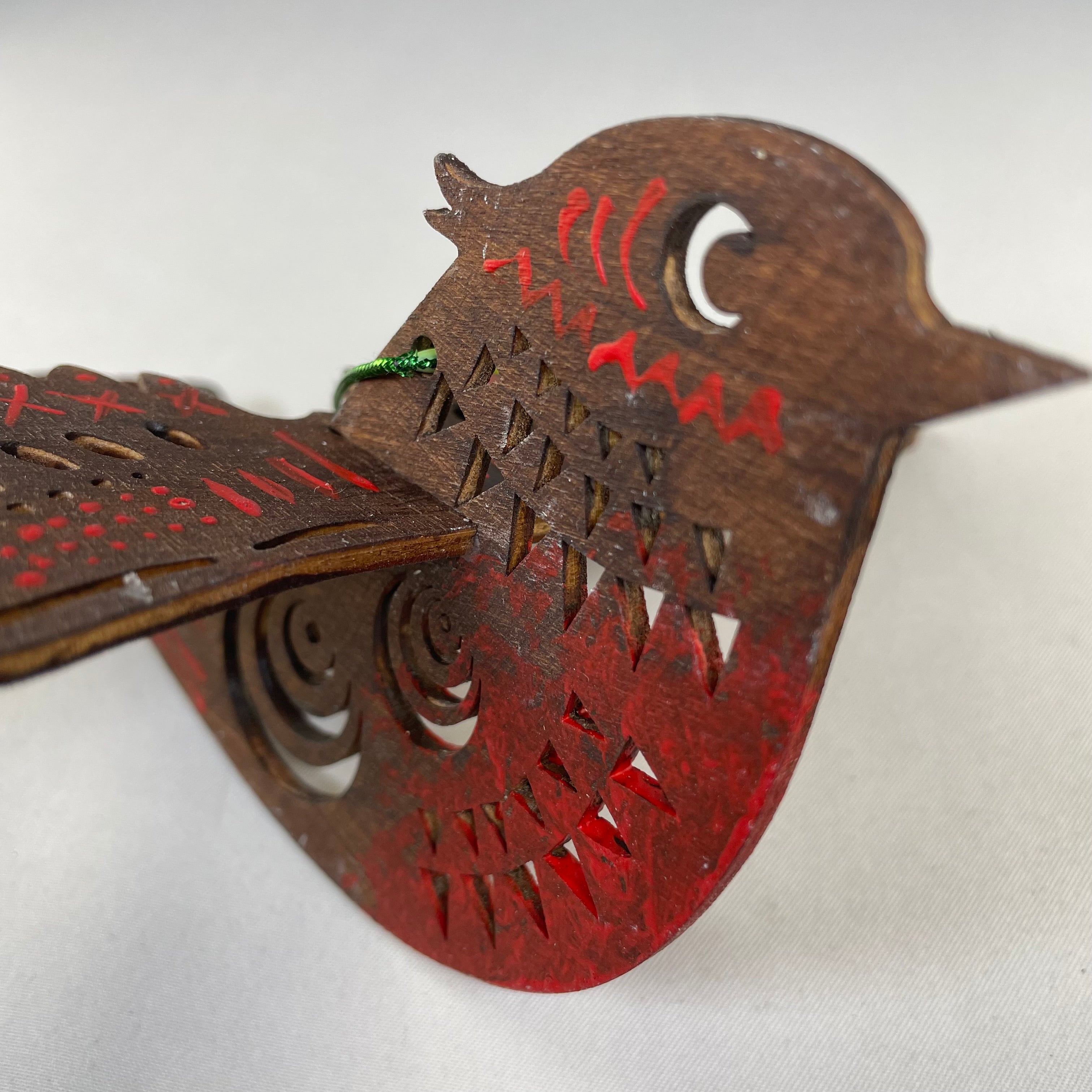 Handmade Christmas bird bauble ornament by Curious Rabbit, featuring festive holiday design with vibrant colors and detailed craftwork.