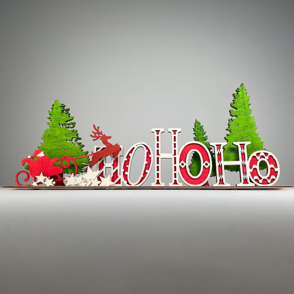 Handmade Christmas "Ho Ho Ho" sign ornament by Curious Rabbit, festive holiday decor with red and white design.