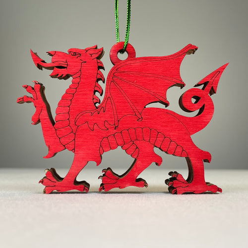 Handmade Welsh Dragon bauble ornament from Curious Rabbit, featuring a detailed red and green dragon design on a festive holiday decoration.