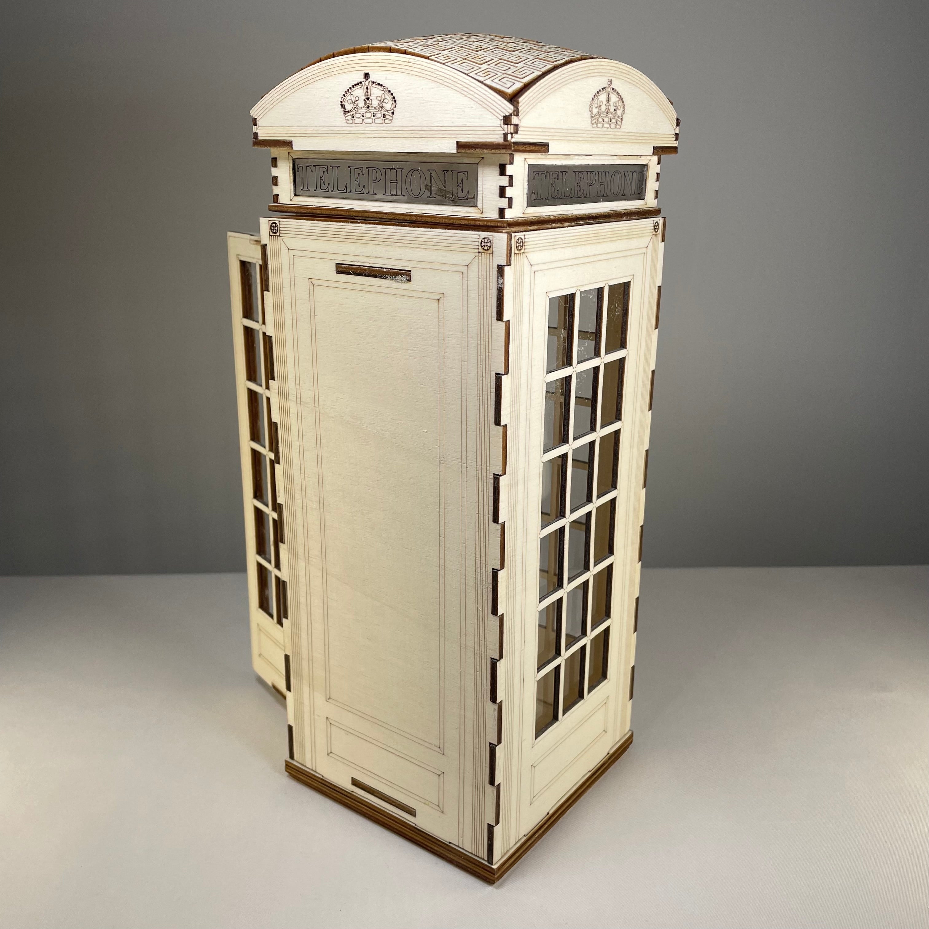 Curious Rabbit Telephone Box Lamp flatpack model kit icon, showing assembled colorful vintage-style telephone box lamp design.
