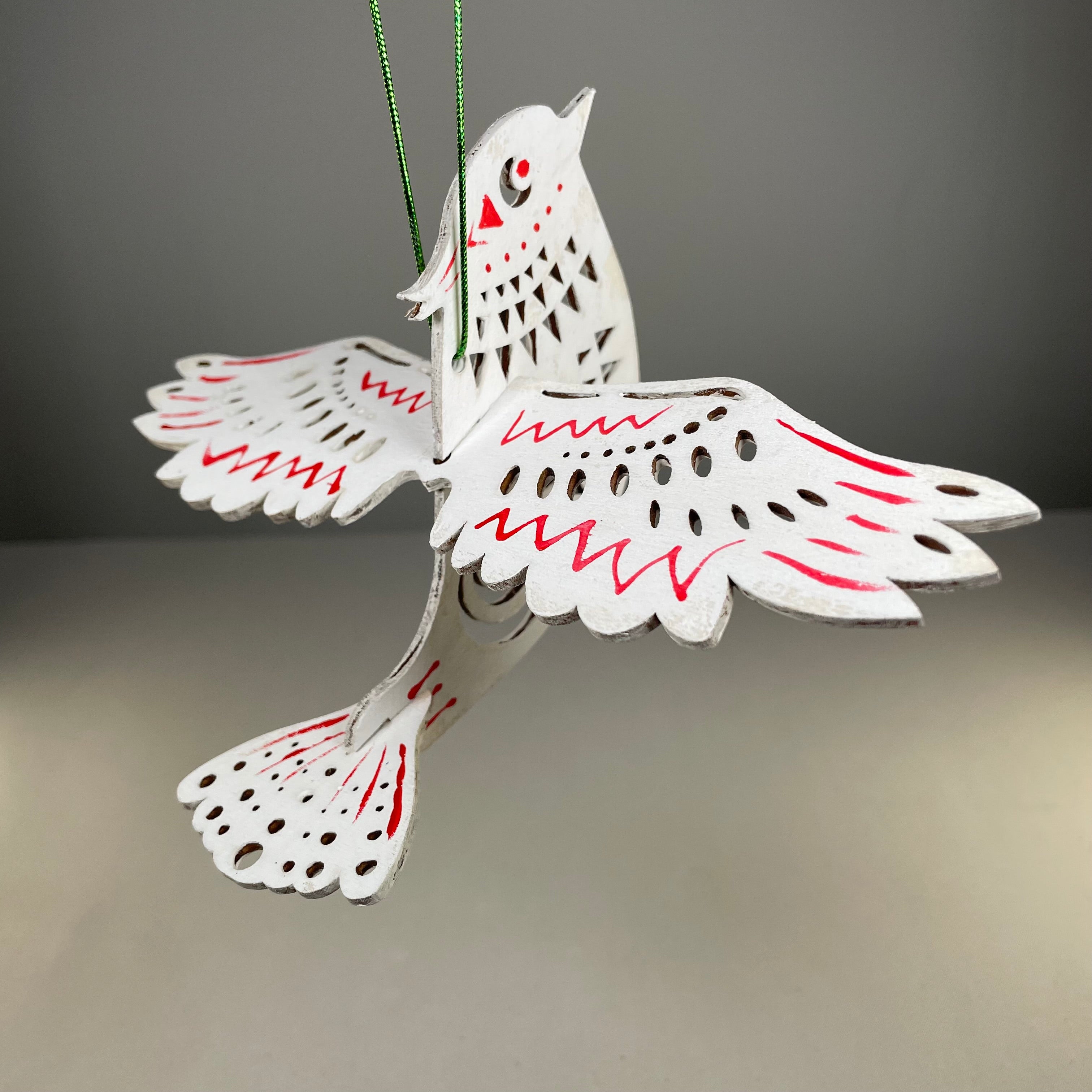 Handmade Christmas bird bauble ornament by Curious Rabbit, featuring festive holiday bird design for Christmas decor.