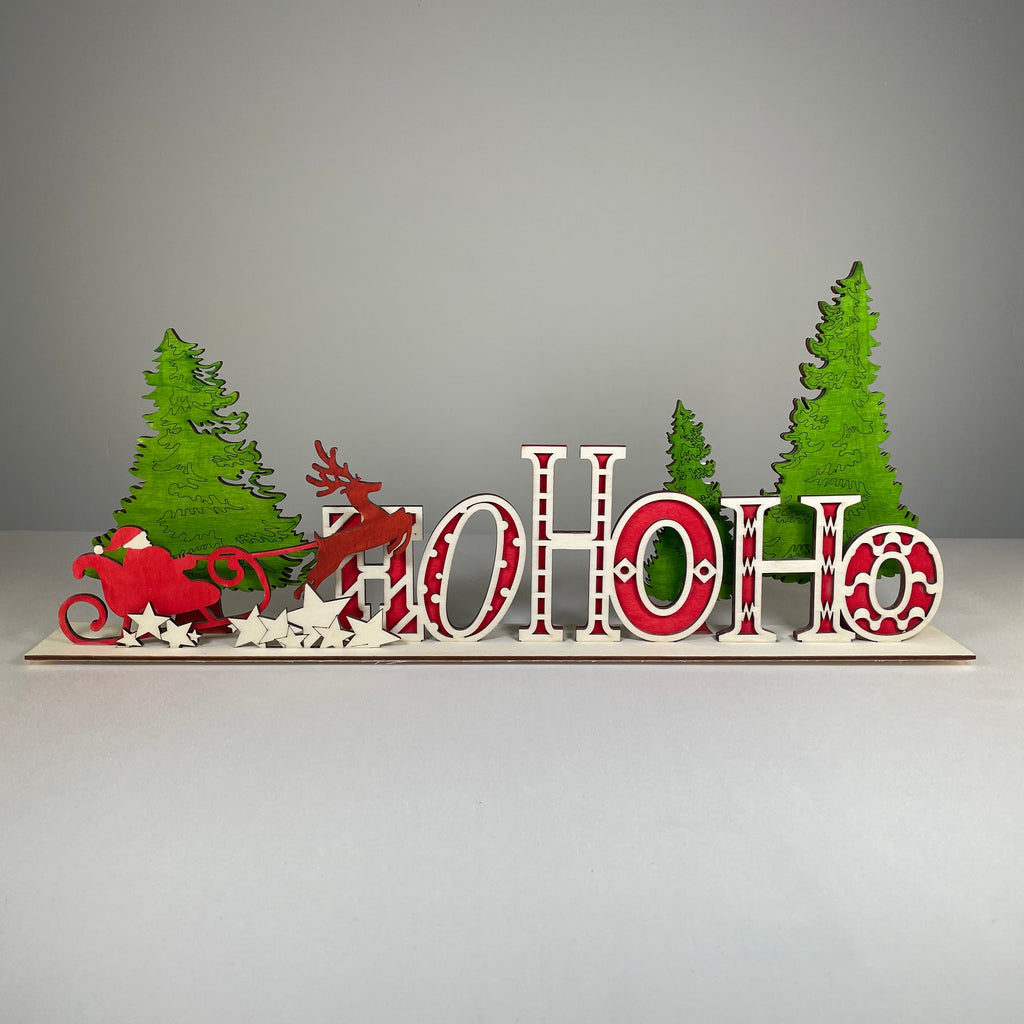 Handmade Ho Ho Ho Christmas ornament sign by Curious Rabbit, featuring festive holiday lettering and decorative design.