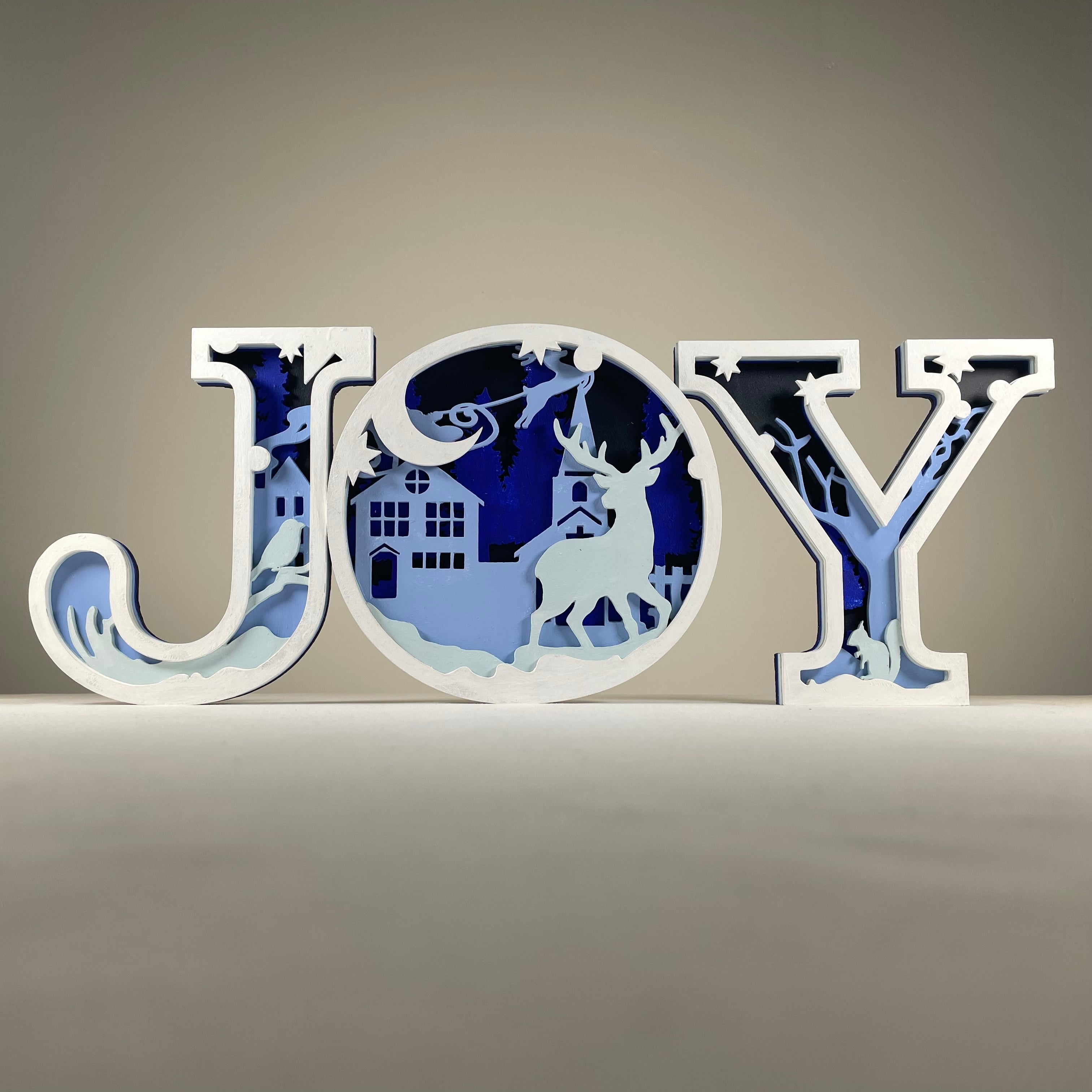 Handmade Christmas joy sign ornament by Curious Rabbit with festive holiday design and cheerful message.