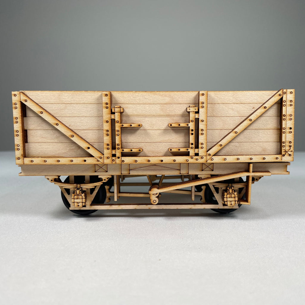 Curious Rabbit railway train wagon flatpack model kit, detailed metal train wagon with wheels and construction parts.