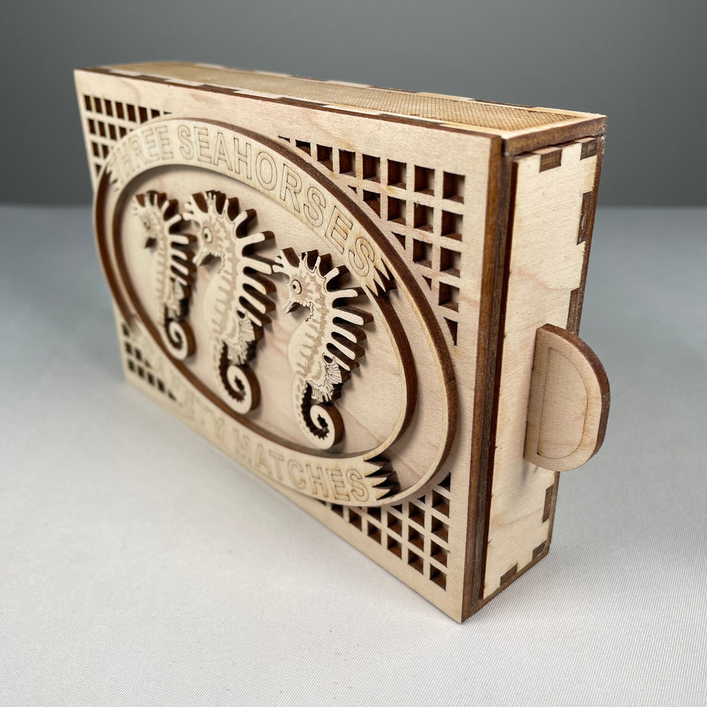 Vintage Curious Rabbit Matchbox Seahorse flatpack model kit showing assembled beige seahorse figure with intricate details.