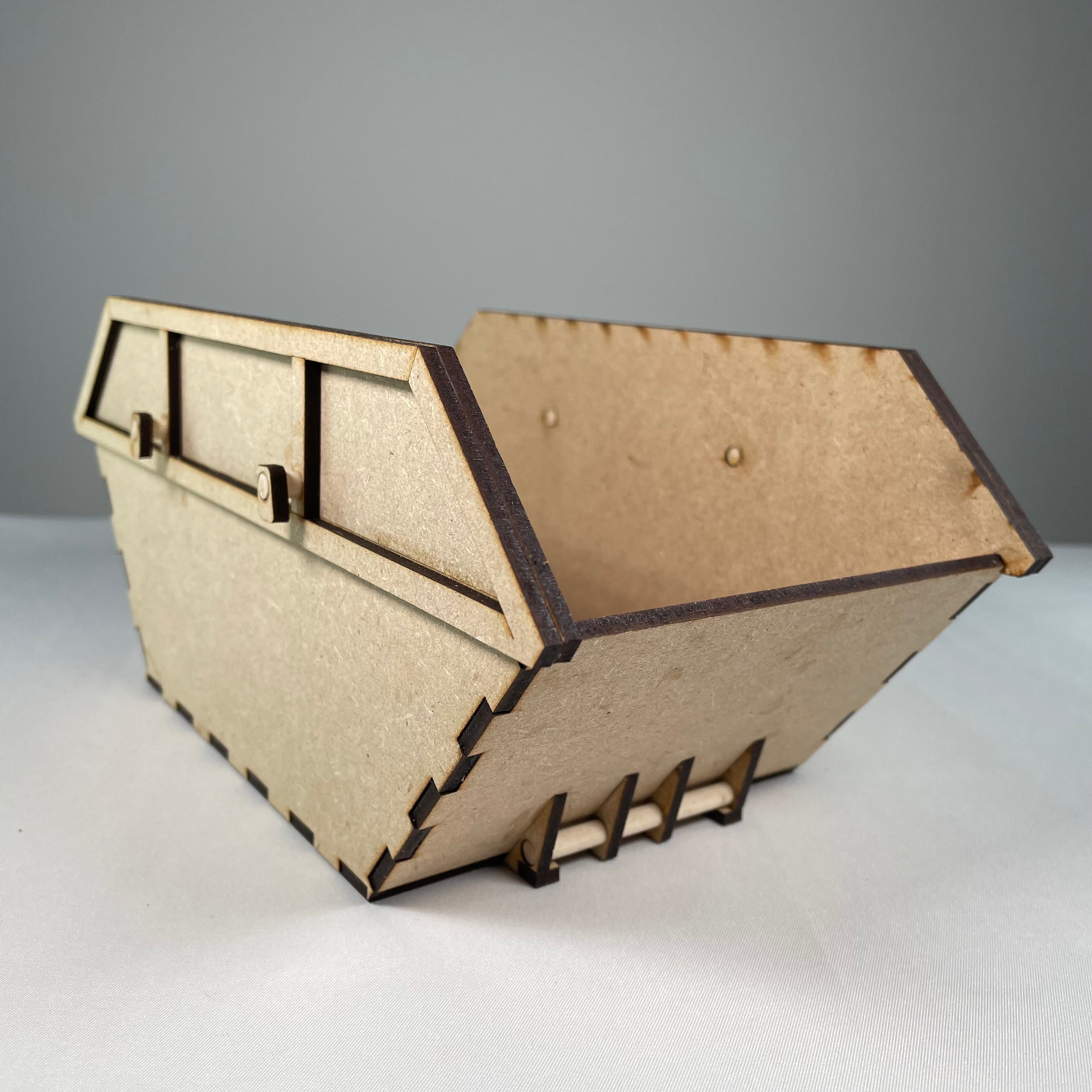Icons of a Skip Waste Container Flatpack Model Kit by Curious Rabbit, showcasing detailed, colorful illustrations of the container parts.