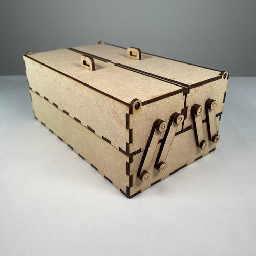 Two-tier flatpack Curious Rabbit toolbox with open compartments, showing a sturdy metal construction and ergonomic handle.