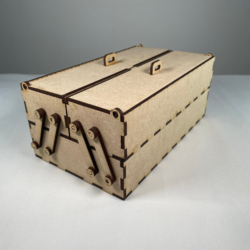 Curious Rabbit two-tier flatpack toolbox with open compartments and sturdy handle, designed for easy storage and transport.