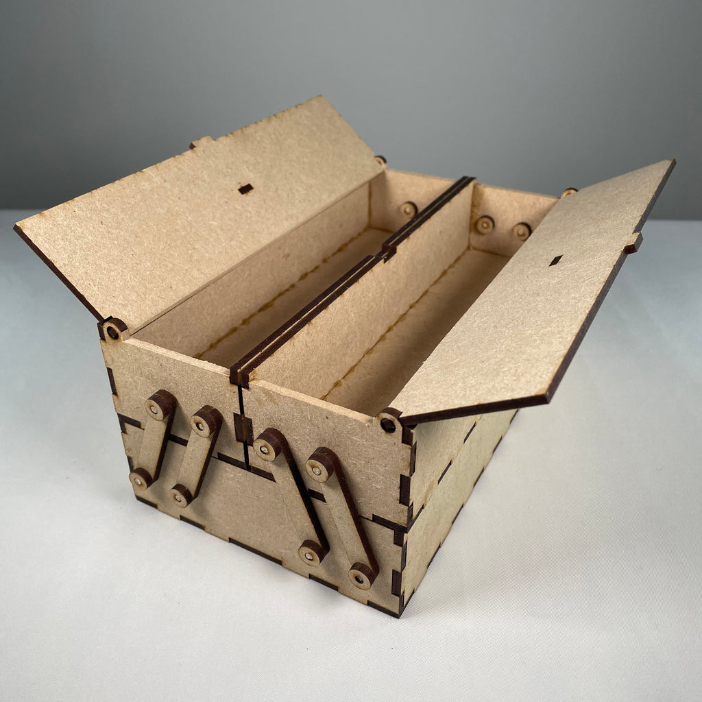 Curious Rabbit two-tier flatpack toolbox with open compartments and sturdy handle, perfect for organizing tools.