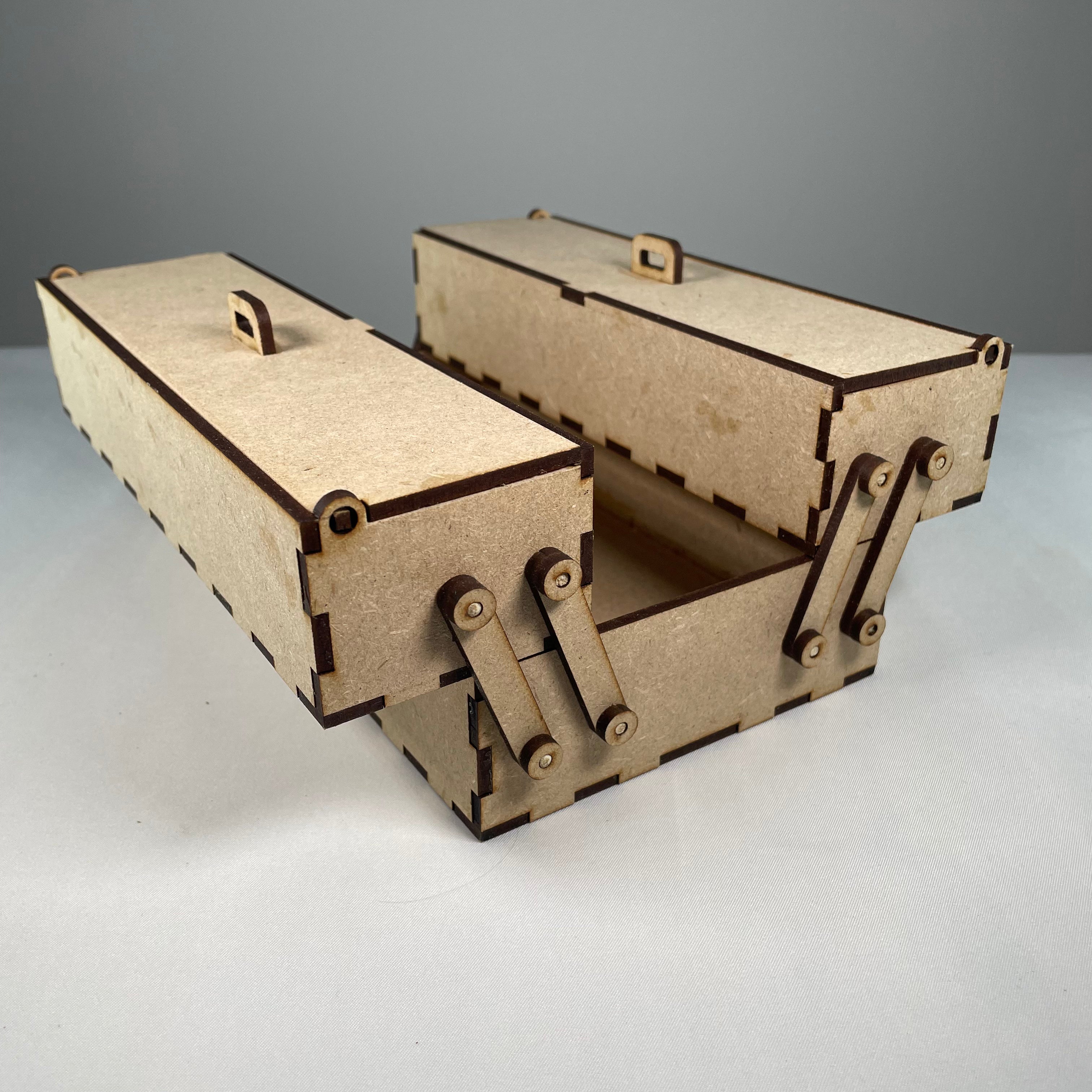 Two-tier Curious Rabbit flatpack toolbox with open lid, showing interior compartments and sturdy construction for organizing tools.