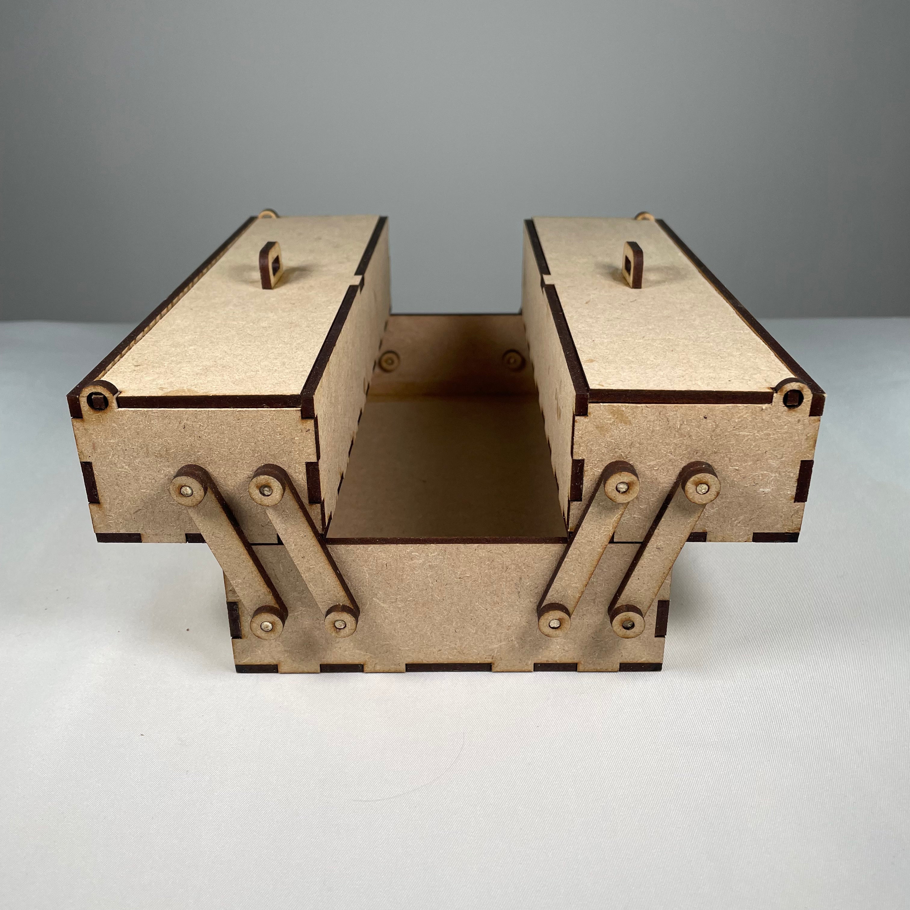 Curious Rabbit two-tier flatpack toolbox with open compartments, designed for organized storage and easy transport.