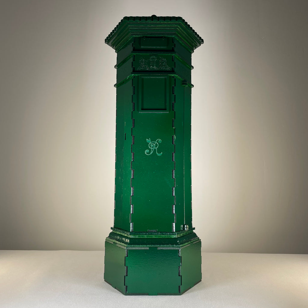 Curious Rabbit Penfold Pillar Post Box flatpack model kit, detailed icon illustration of a classic postal box design.