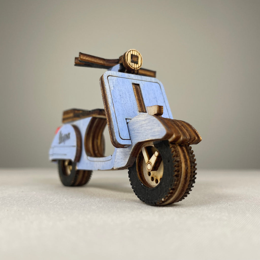 Vintage Curious Rabbit Retro Scooter flatpack model kit assembled, showcasing a detailed, colorful miniature replica of a classic scooter.