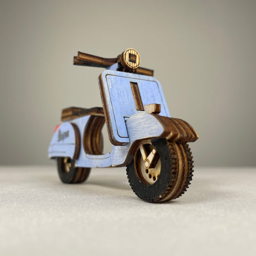 Vintage Curious Rabbit Retro Scooter flatpack model kit assembled, showcasing a detailed, colorful miniature replica of a classic scooter.