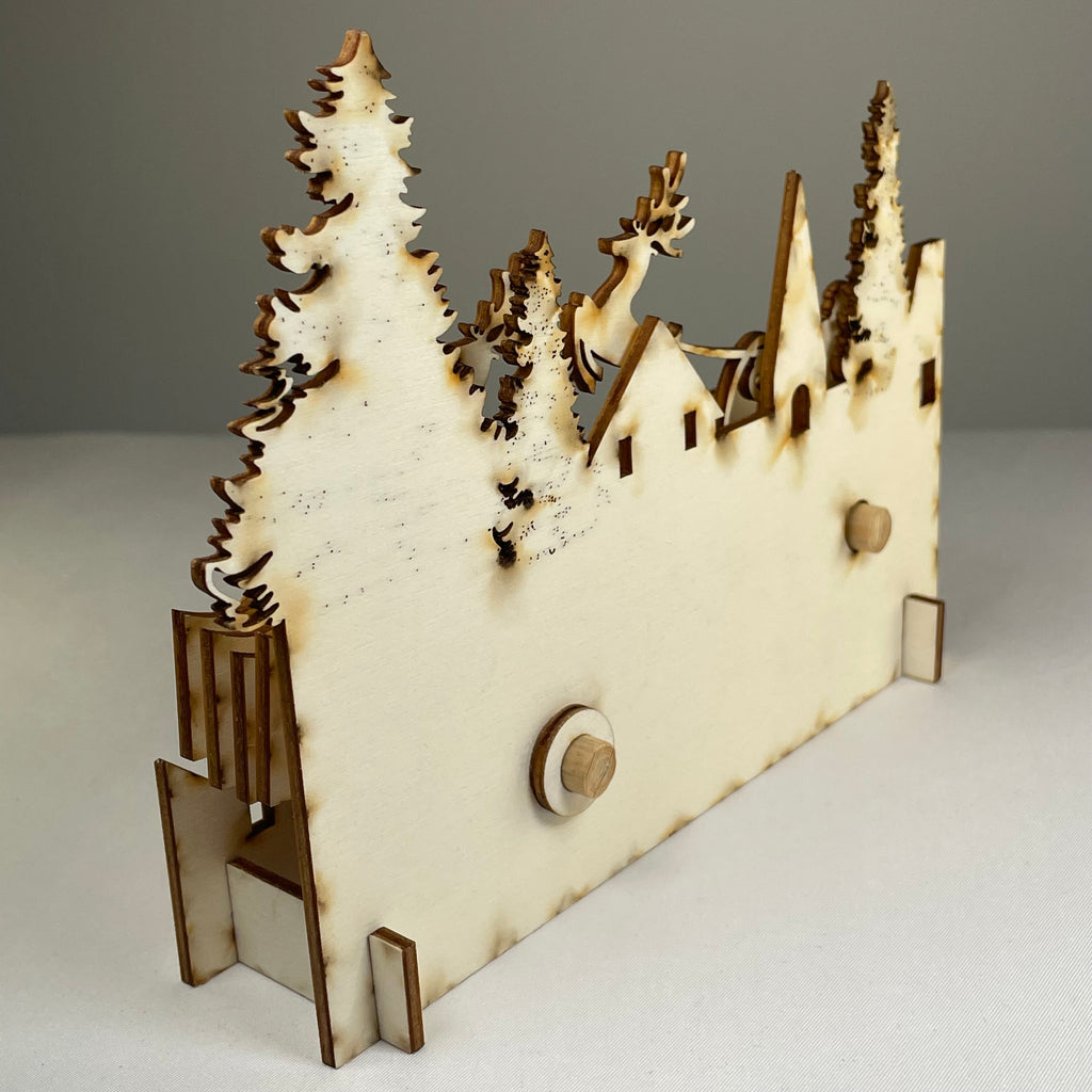 Mechanical Santa sleigh flatpack model kit by Curious Rabbit, showing assembled festive Christmas sleigh with mechanical details.
