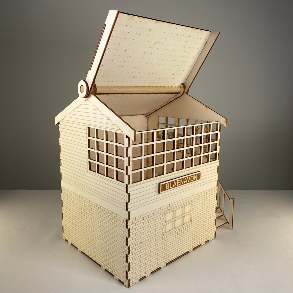 Curious Rabbit railway signal box flatpack model kit with detailed parts, perfect for model train enthusiasts and railway dioramas.