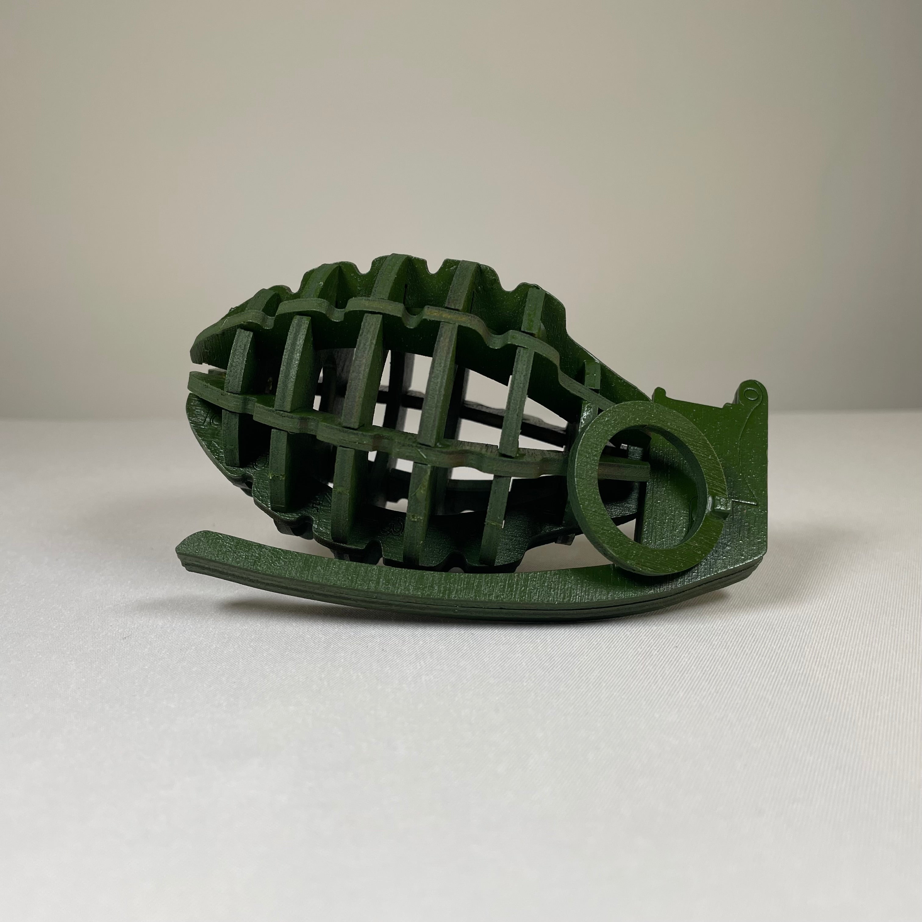 Detailed image of a Prop Mk 2 Grenade flatpack model kit by Curious Rabbit, showcasing the historical military toy in assembled form.