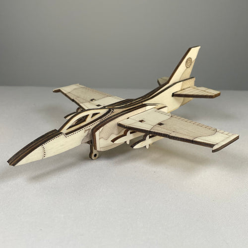 Curious Rabbit Jet Puzzle flatpack model kit featuring a detailed historical jet aircraft with assembled parts on display.