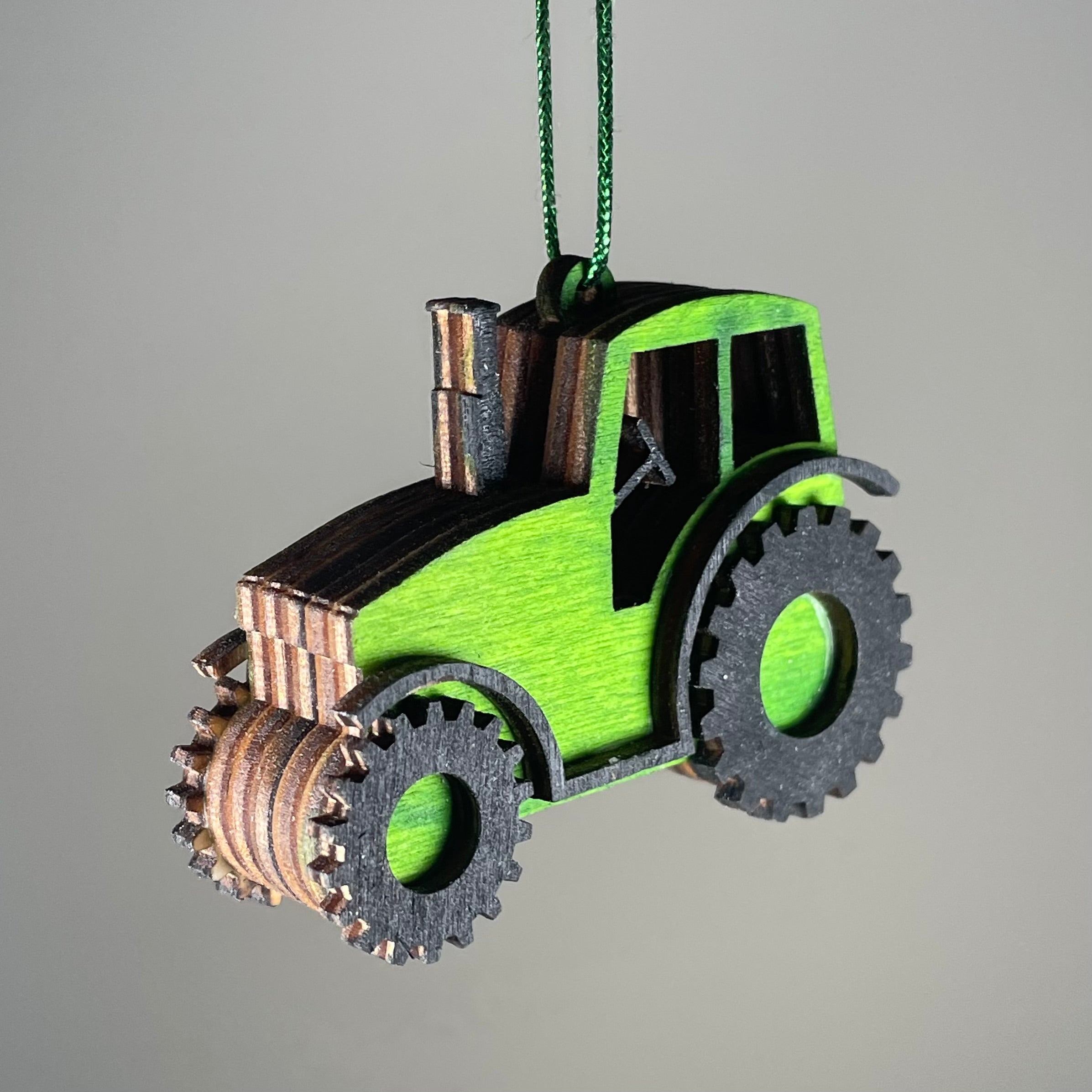 Handmade Curious Rabbit tractor garden bauble ornament with detailed craftsmanship, ideal for outdoor garden decor.