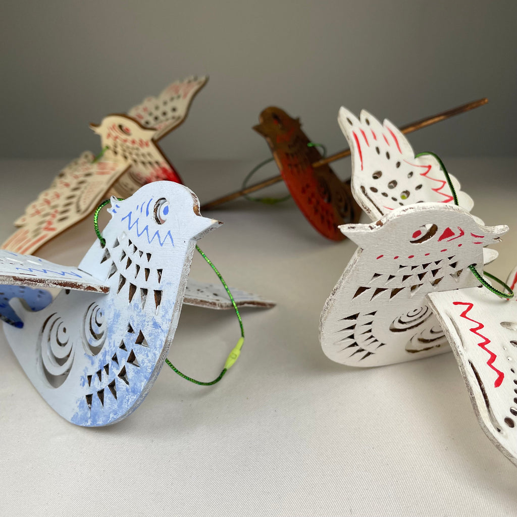 Handmade Christmas bird bauble ornament by Curious Rabbit, featuring detailed craftwork and festive holiday design.