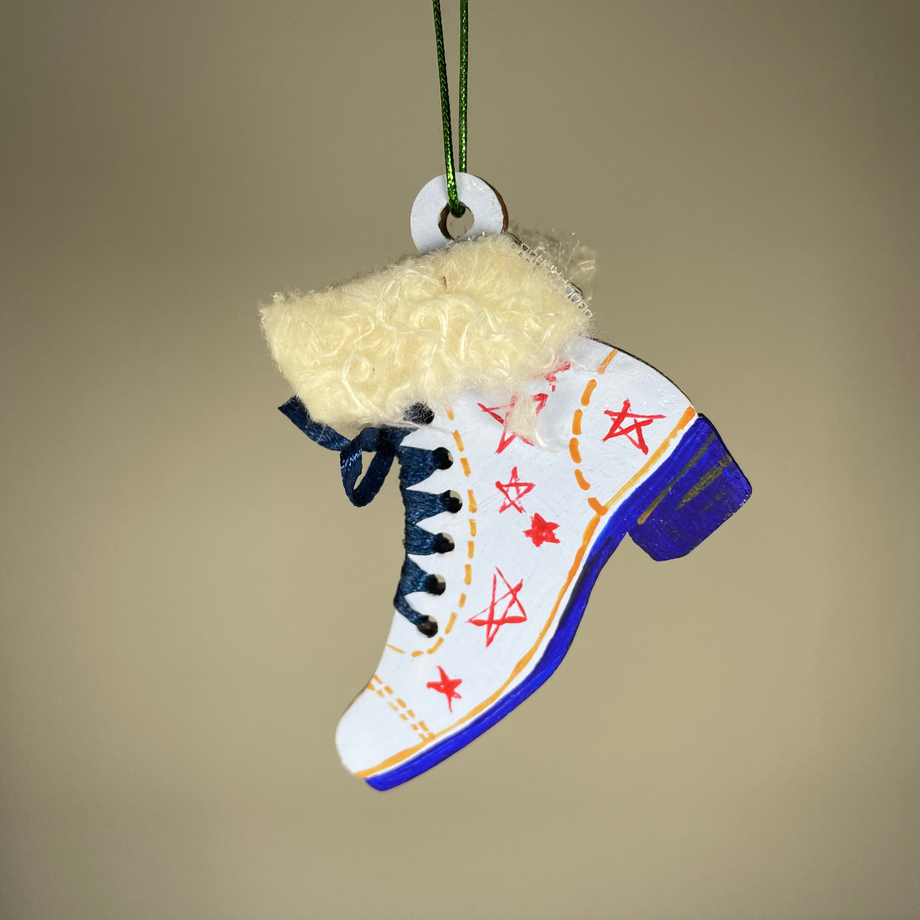 Handmade Christmas ice skate ornament by Curious Rabbit, featuring a festive bauble design for holiday decoration.