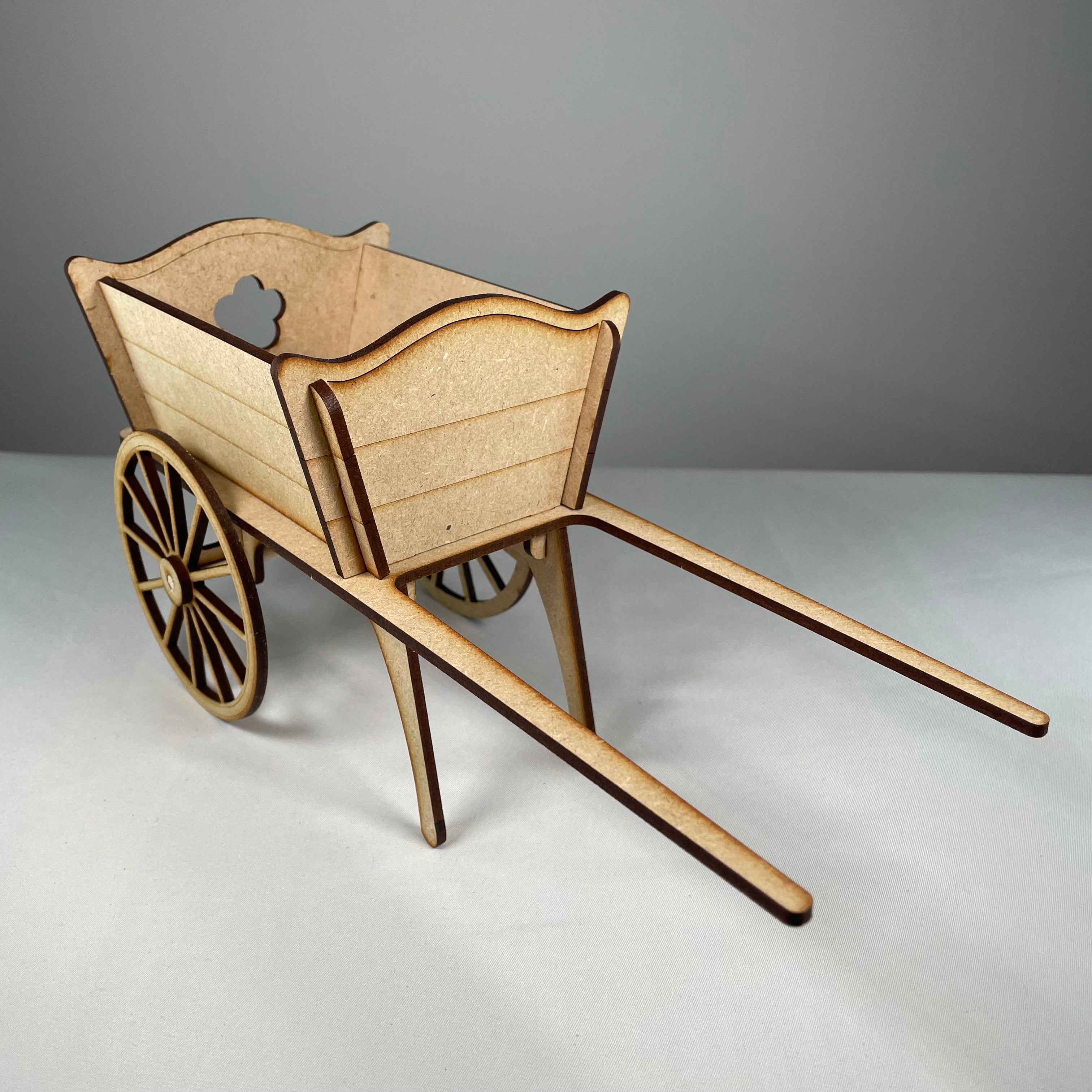 Curious Rabbit flatpack garden cart planter kit with assembled wooden components and plant compartments.