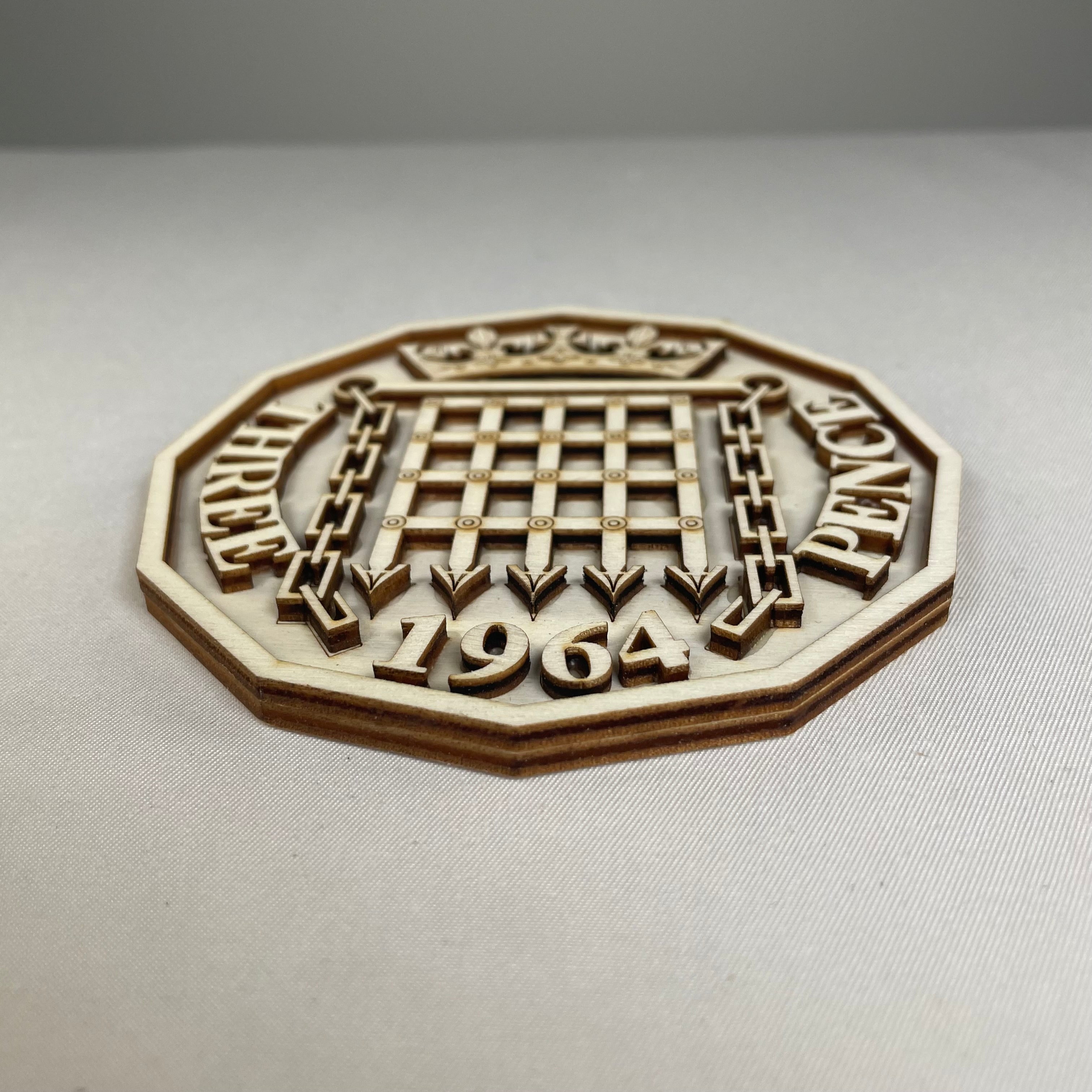 Handmade Three Pence coaster by Curious Rabbit featuring intricate icon designs on ceramic tableware.