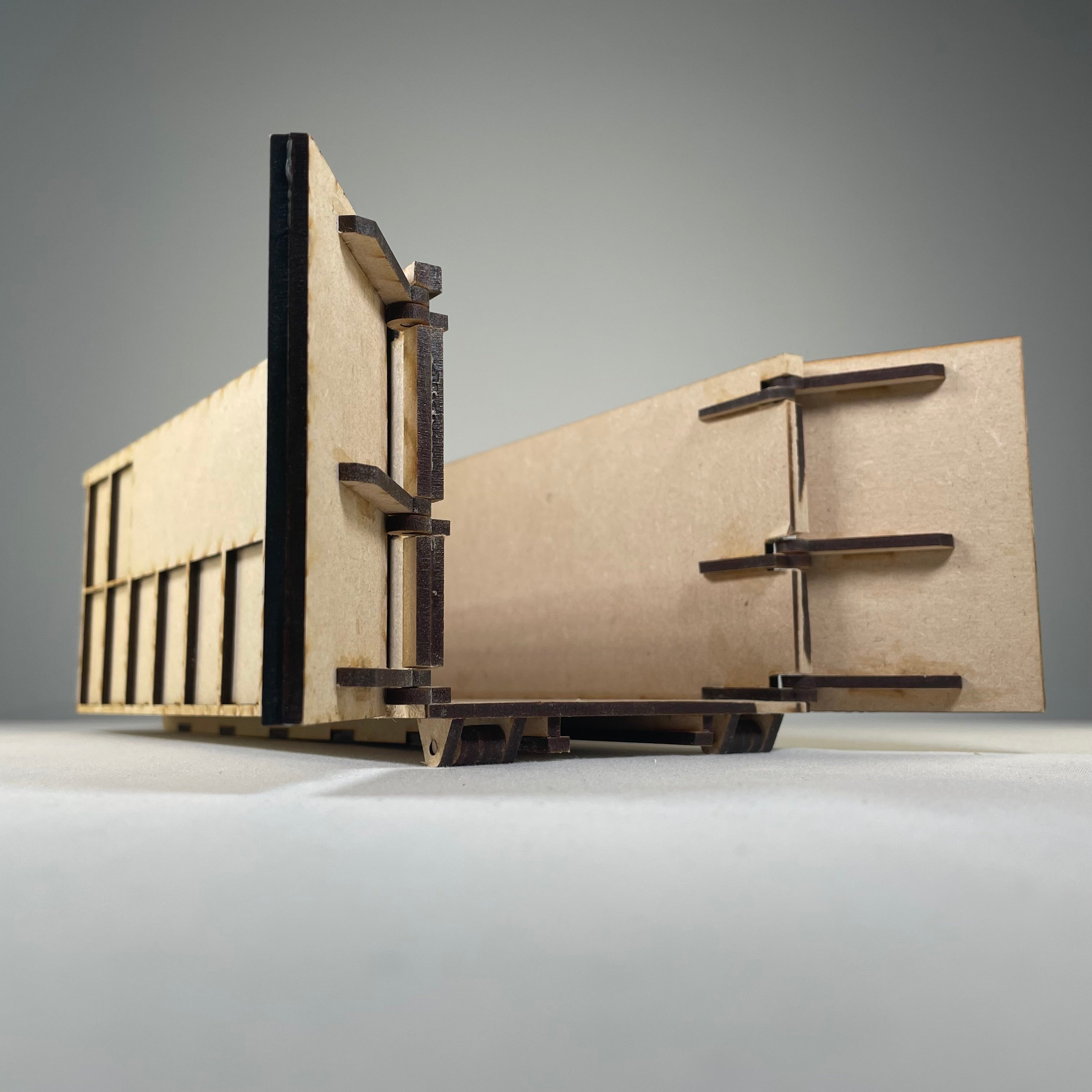 Icons depicting a Curious Rabbit Roll-on / Roll-off Skip (RORO) flatpack model kit for construction and waste management.