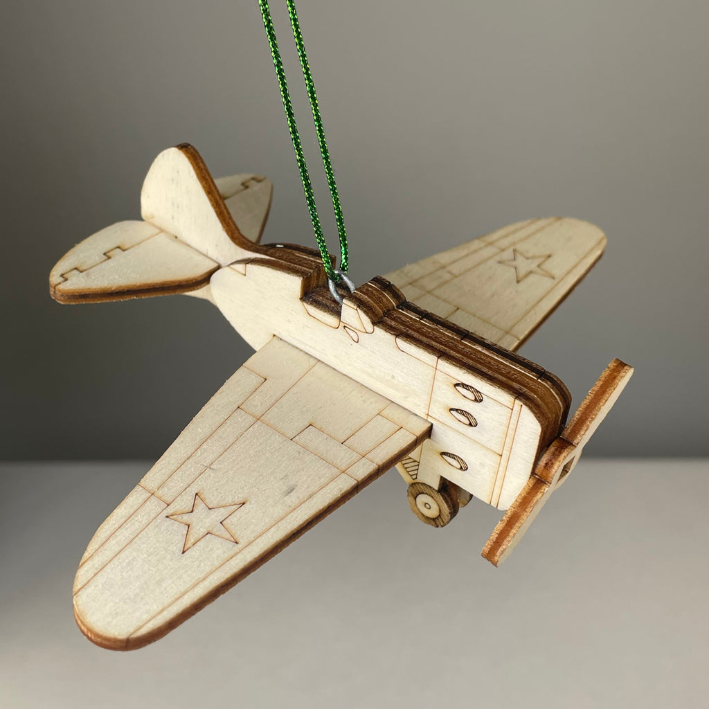 Handmade Plane Bauble ornament by Curious Rabbit, featuring detailed historical aircraft design for holiday or decor use.