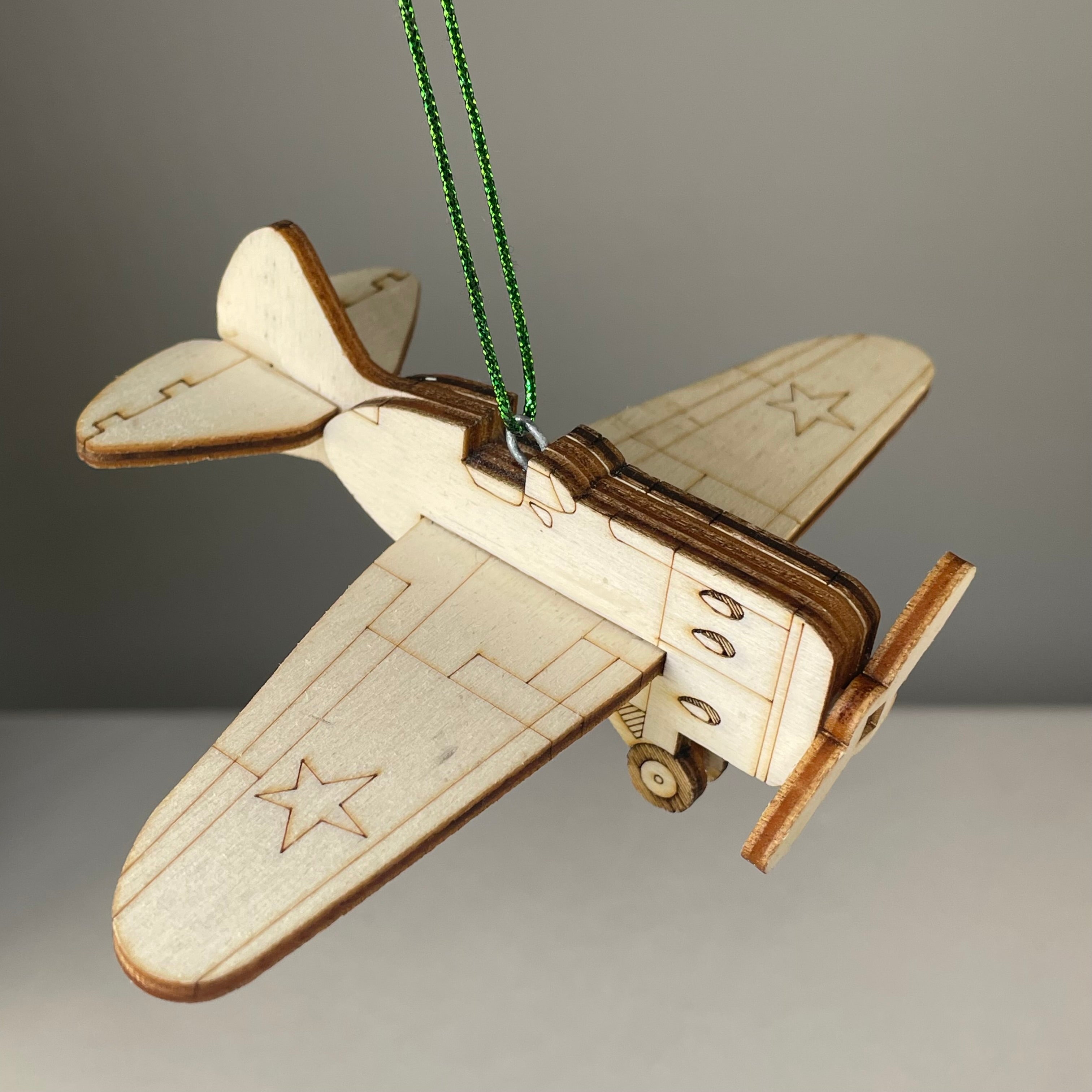 Handmade Plane Bauble ornament by Curious Rabbit, featuring detailed historical aircraft design for holiday or decor use.