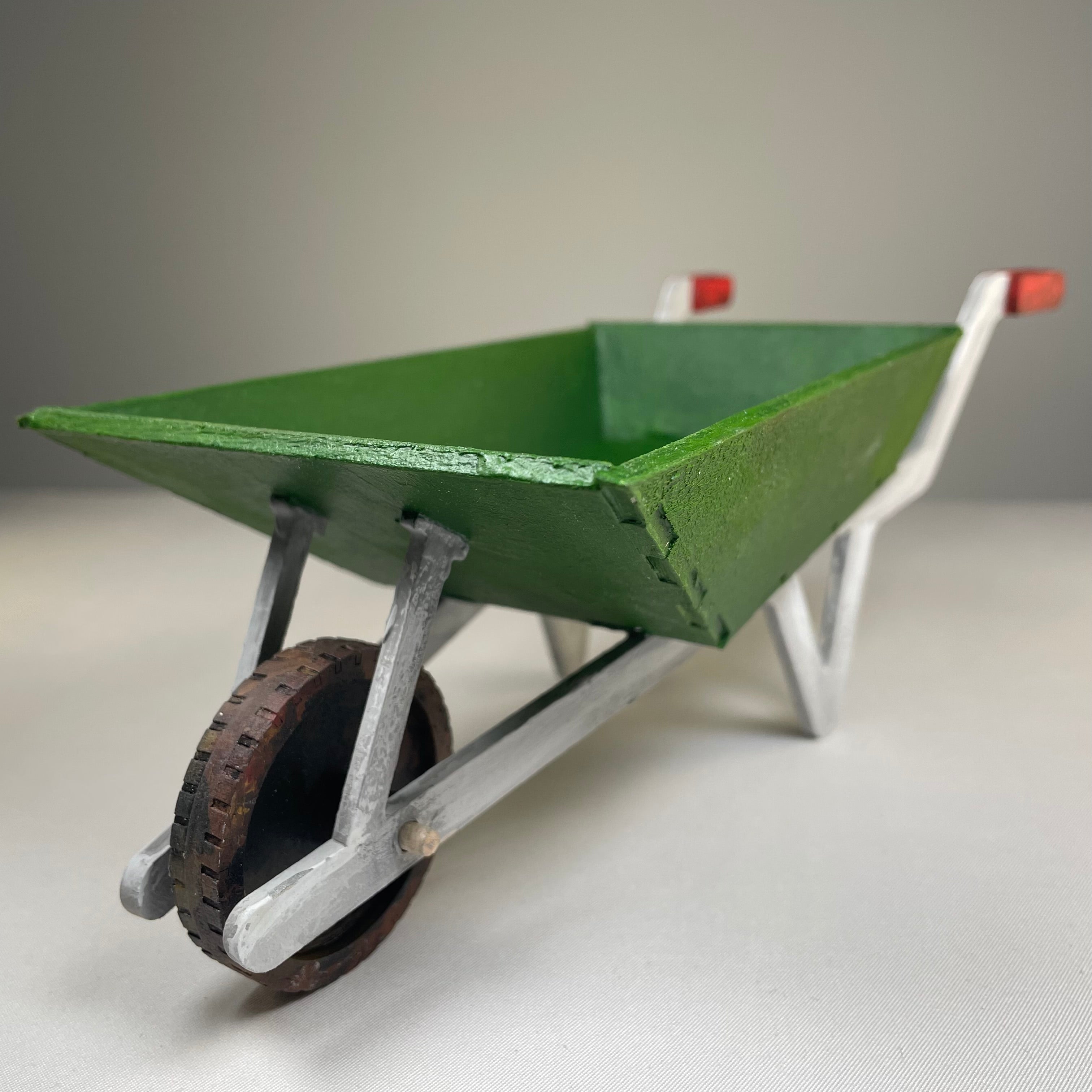 Curious Rabbit wheelbarrow planter garden kit with flatpack design, showcasing assembled wooden wheelbarrow for planting and decoration.