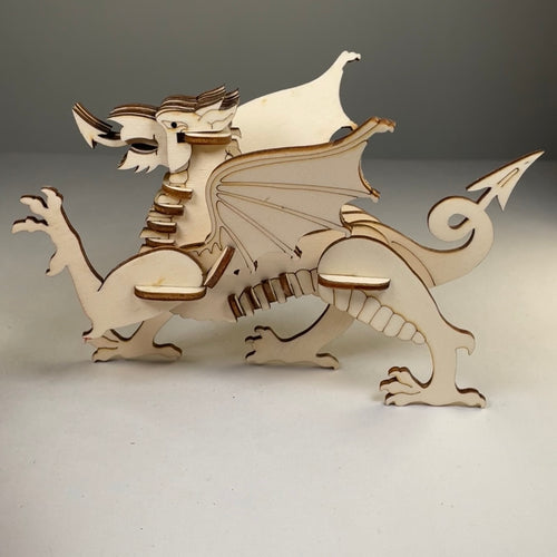 Curious Rabbit Welsh Dragon puzzle flatpack model kit showing assembled colorful dragon with detailed scales and wings.