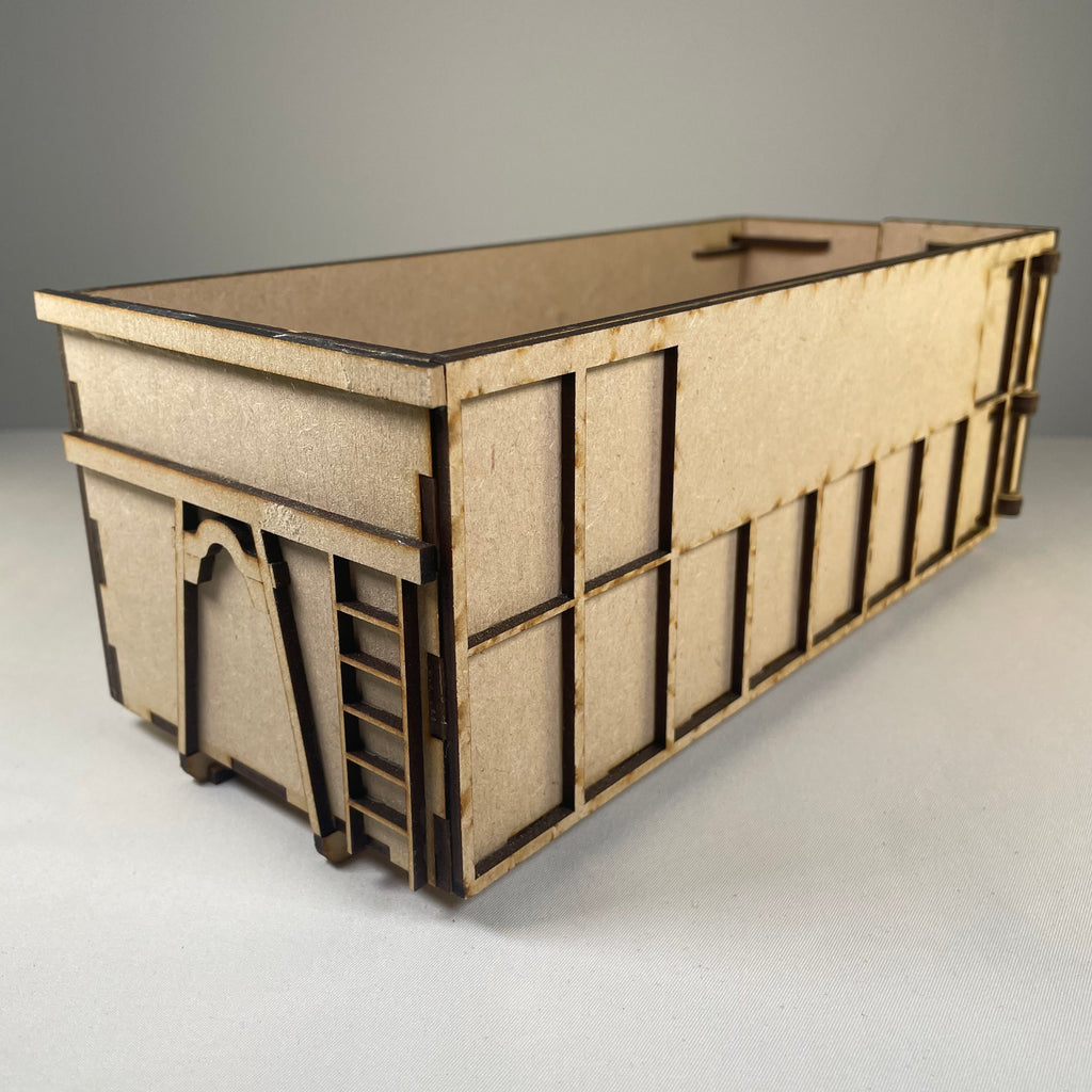Icons of a roll-on/roll-off skip flatpack model kit by Curious Rabbit, showing simplified design and packaging details.