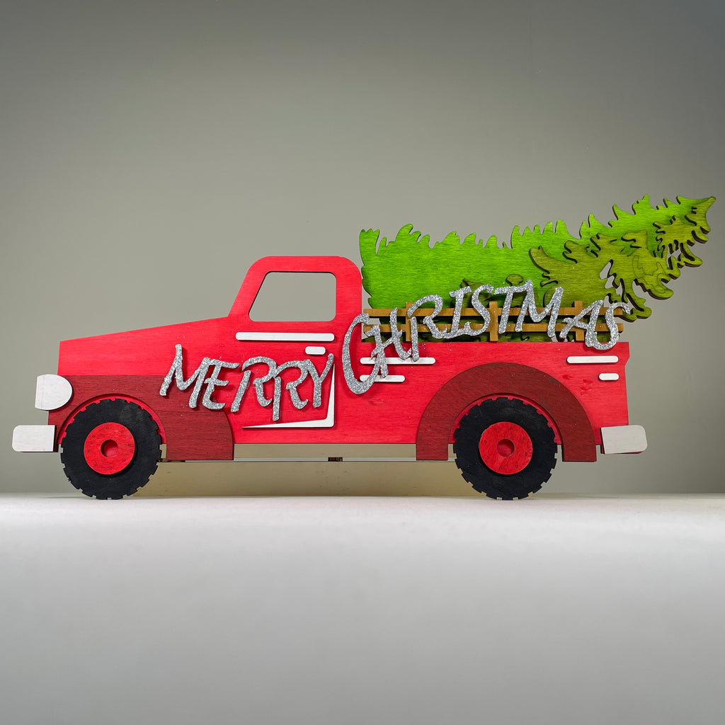 Handmade Curious Rabbit Merry Christmas Truck tree sign ornament with festive holiday design and decorative lettering.