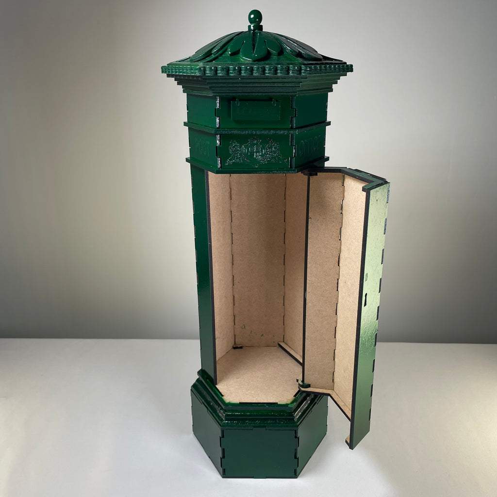 Curious Rabbit Penfold Pillar Post Box flatpack model kit with icon-style design, showing assembled miniature postal box in natural finish.