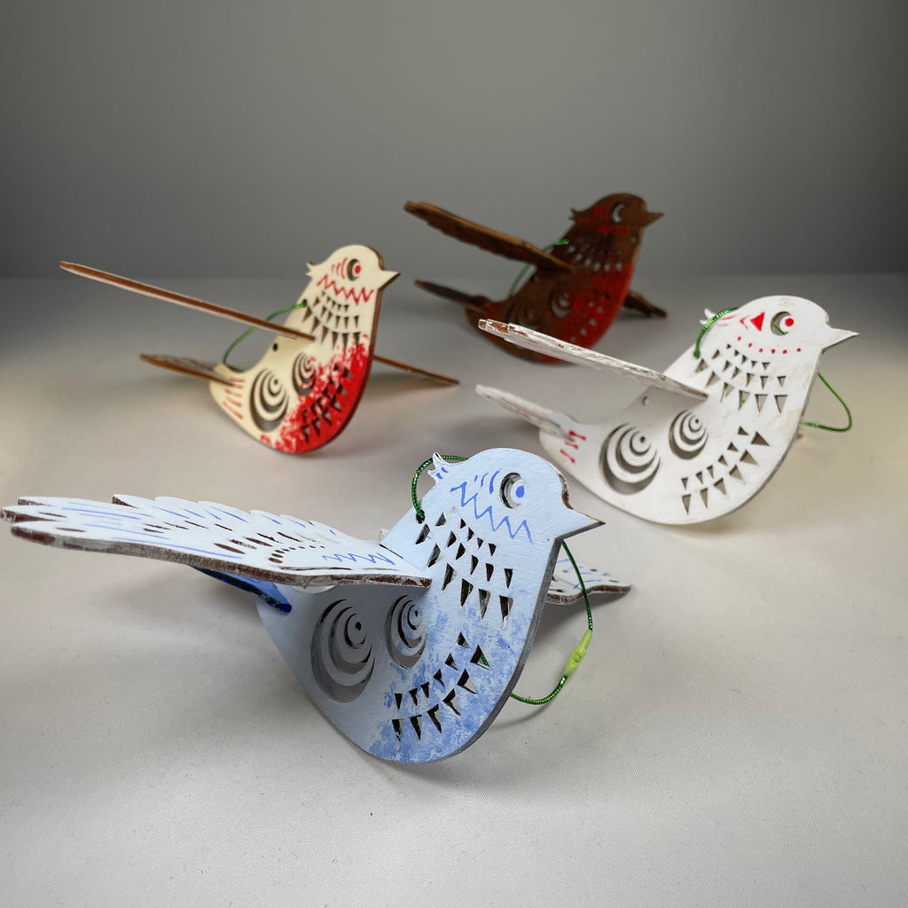 Handmade Christmas bird bauble ornament by Curious Rabbit, festive holiday decoration with detailed bird design.