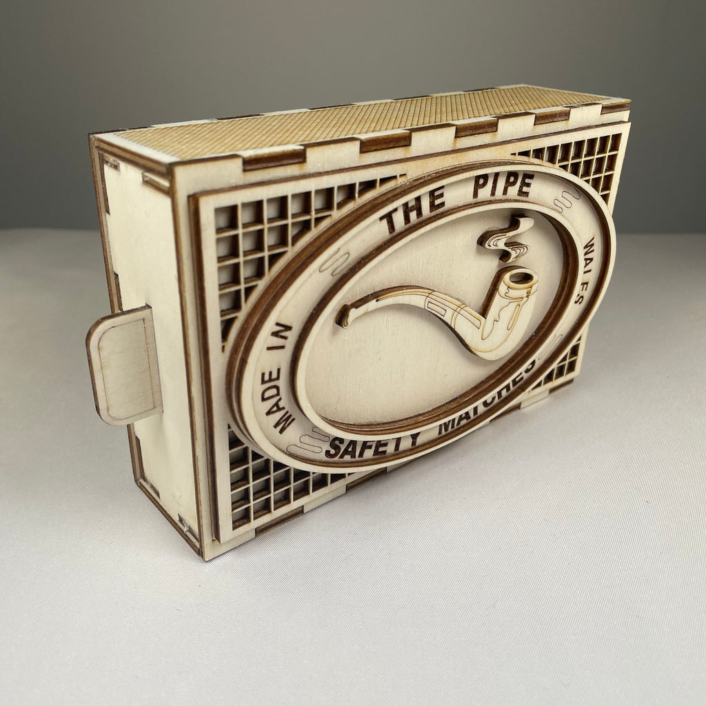 Vintage Curious Rabbit matchbox pipe flatpack model kit with detailed parts laid out for assembly.